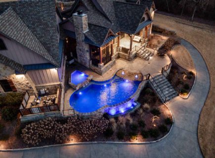 House with swimming pool at night