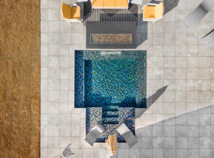 a compact square inground pool from above
