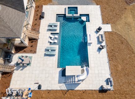inground swimming pool with water slide