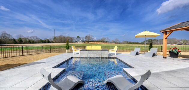 a cocktail pool with tanning ledges in the pool