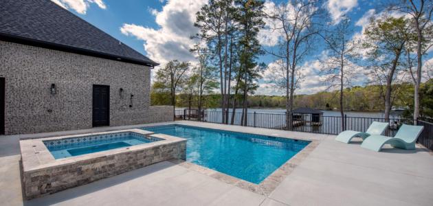 small geometric pool with small above ground spa in the middle