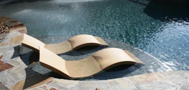 tanning ledge loungers in shallow pool platform